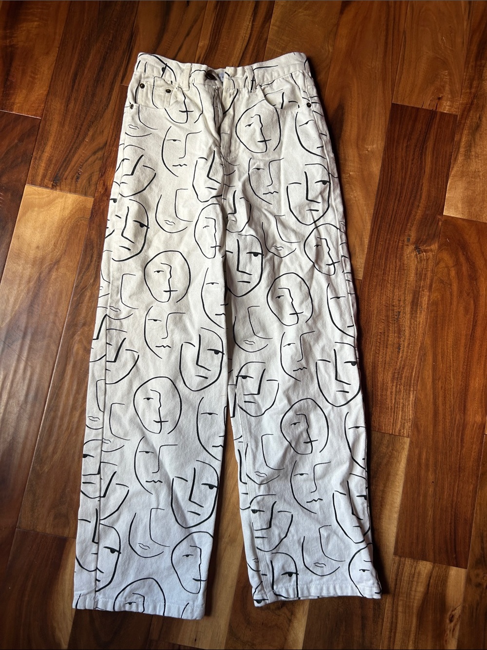 Shekou - Cream Straight-Leg Pants with Abstract Face Print